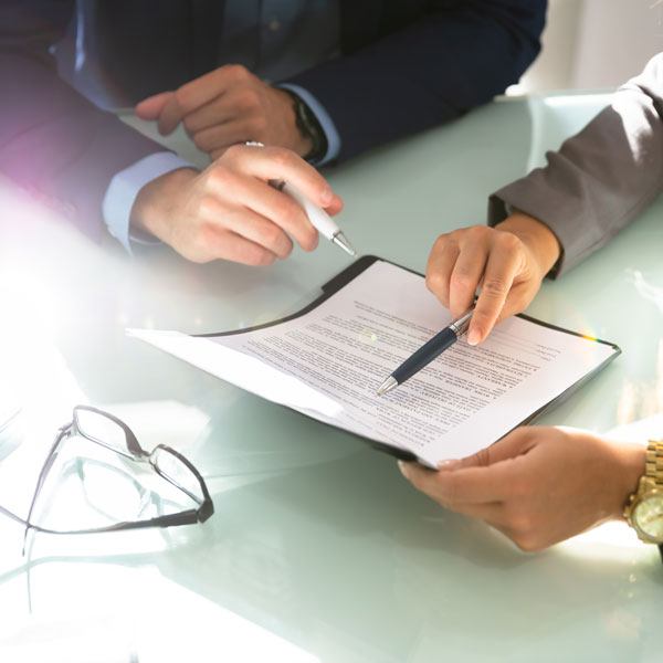 lawyer going over paperwork with client